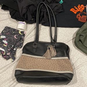 Used black and beige purse